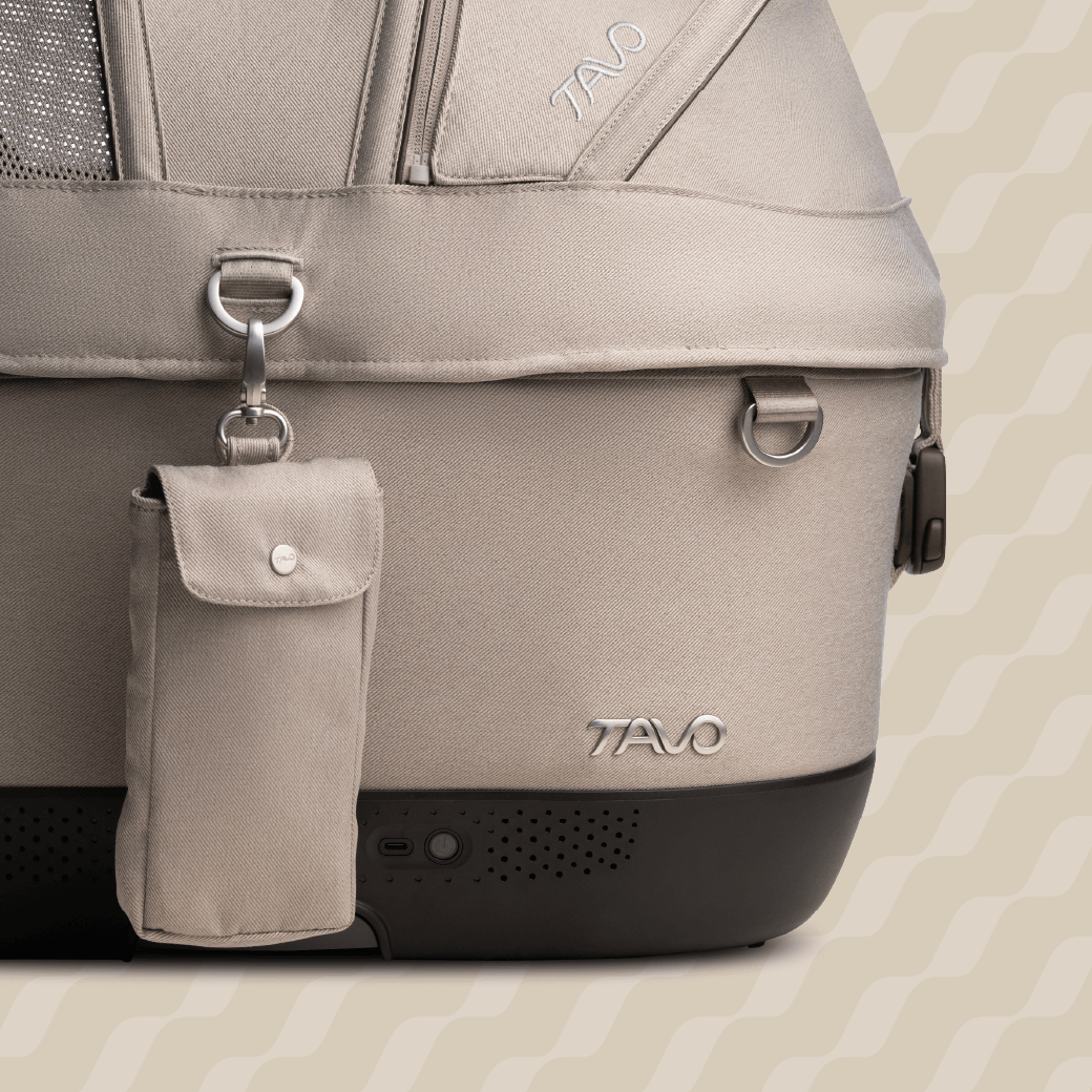 A close up image of the Maeve iso 6x Wind Pet Car Seat in the fashion fawn with a view of the battery power bank pouch
